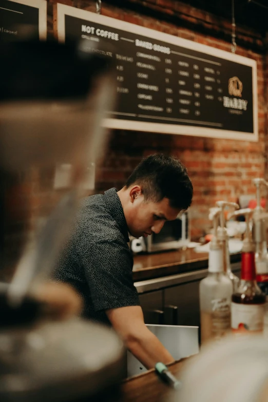 a man standing in a kitchen preparing food, by Robbie Trevino, coffee shop, profile image, asian male, cold brew coffee )