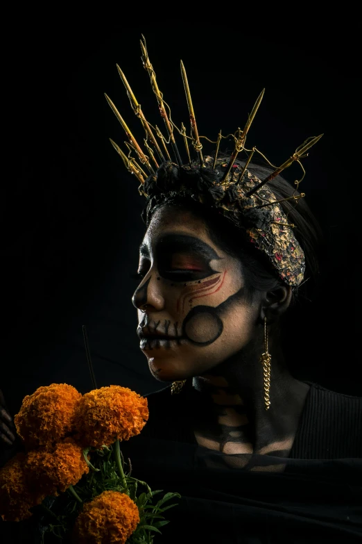 a woman with black face paint holding a bouquet of flowers, inspired by Ángel Botello, vanitas, gold crown and filaments, dark complexion, photograph taken in 2 0 2 0, bone jewellery