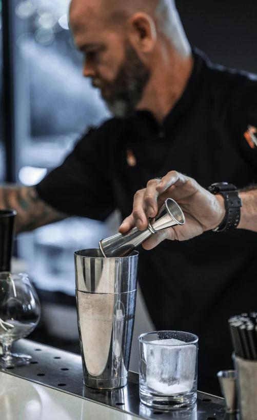 a bartender mixes a drink at a bar, by Ndoc Martini, profile image, dynamic closeup, aussie baristas, stainless steel