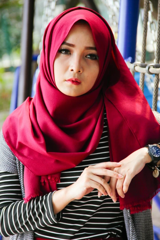 a woman wearing a red hijab poses for a picture, inspired by Naza, shutterstock, square, casual clothing style, maroon, serious look