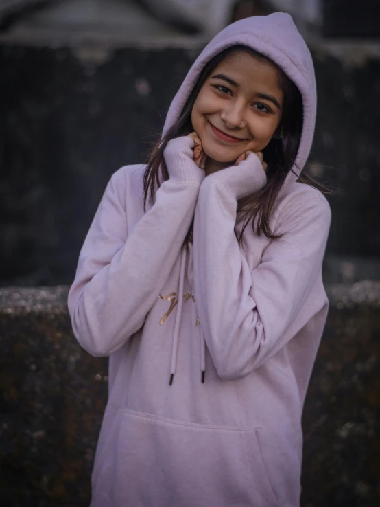 a close up of a person wearing a hoodie, light pink, posing for a picture, happy girl, ((purple))