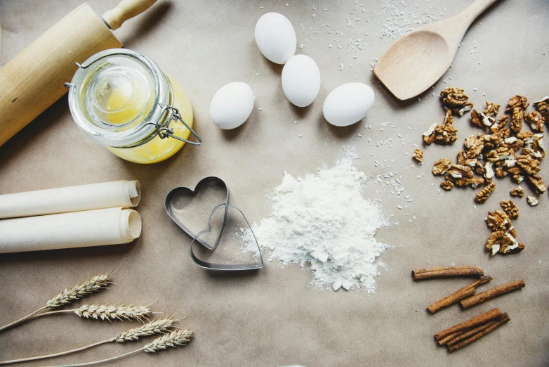 ingredients and utensils laid out on a table, a still life, trending on pexels, baking cookies, parchment, thumbnail, background image