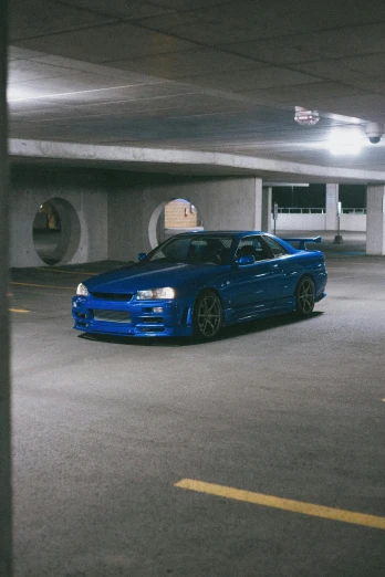 a blue car parked in a parking garage, inspired by An Gyeon, pexels contest winner, in a modified nissan skyline r34, portrait n - 9, 15081959 21121991 01012000 4k, album photo