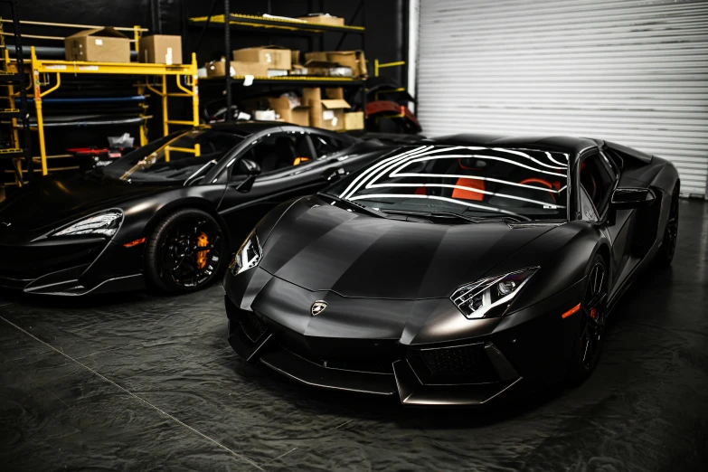 two black sports cars parked in a garage, pexels contest winner, hyperrealism, lamborghini aventador photoshoot, samurai vinyl wrap, 15081959 21121991 01012000 4k, asphalt and metal