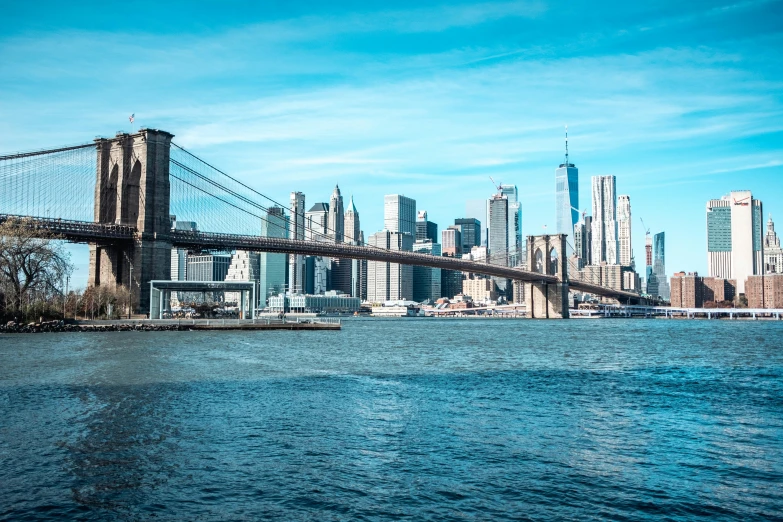 a bridge over a body of water with a city in the background, new york backdrop, instagram post, new york harbour, complex city