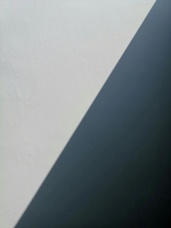 a laptop computer sitting on top of a desk, a minimalist painting, inspired by Agnes Martin, unsplash, postminimalism, powerful shadows, directional sunlight skewed shot, abstract detail, two colors