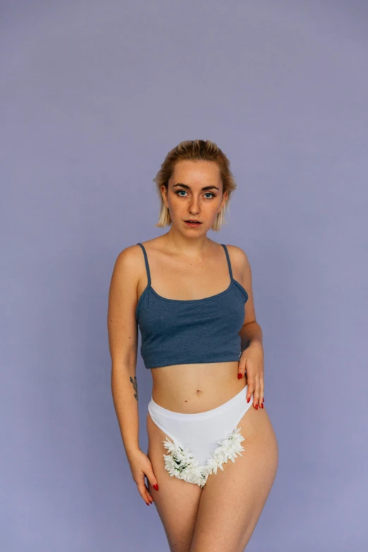 a woman in a blue top and white panties, inspired by Elsa Bleda, reddit, nonbinary model, croptop, avatar image, 5 0 0 px models