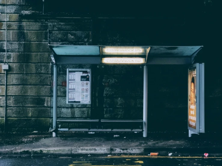 a bus stop sitting on the side of a road, inspired by Elsa Bleda, pexels contest winner, dimly lit underground dungeon, boarded up, station, 2000s photo