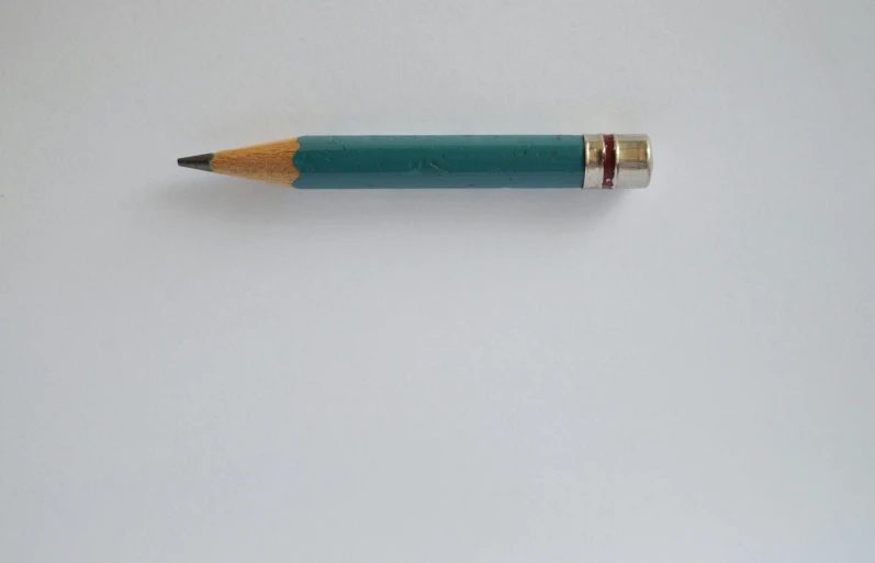 a blue pencil sitting on top of a white surface, by Gavin Hamilton, unsplash, hyperrealism, taken in the mid 2000s, teal, 1956, modeled