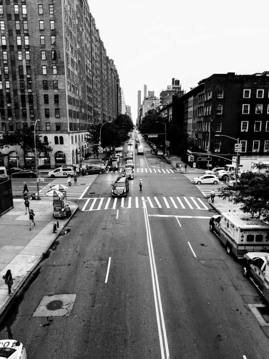 a black and white photo of a city street, by Adam Rex, bird\'s eye view, taken on iphone 14 pro, nypd, summer day