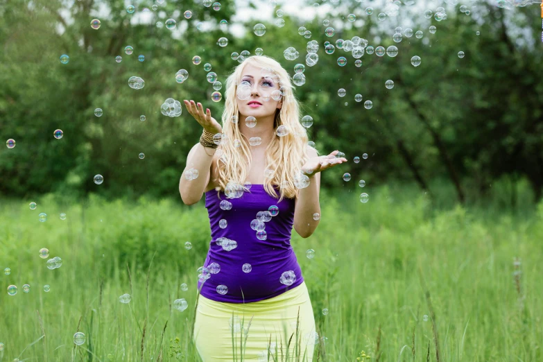 a woman blowing bubbles while standing in a field, a portrait, by Julia Pishtar, pixabay, process art, publicity cosplay, avatar image, a blond, studio photo