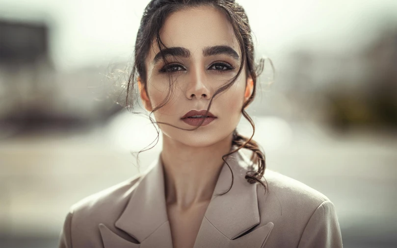 a woman with her hair blowing in the wind, a character portrait, pexels contest winner, hurufiyya, lily collins, arab ameera al taweel, sharp cheekbones, attractive androgynous humanoid