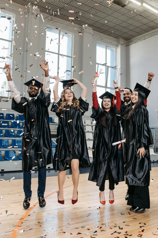 a group of graduates throwing confetti in the air, academic art, leather robes, black, confident