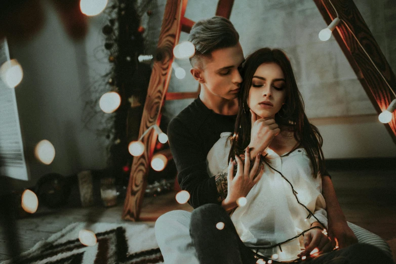 a man and a woman sitting next to each other, a photo, by Emma Andijewska, trending on pexels, aestheticism, fairy lights, tattooed, 15081959 21121991 01012000 4k, ( ultra realistic