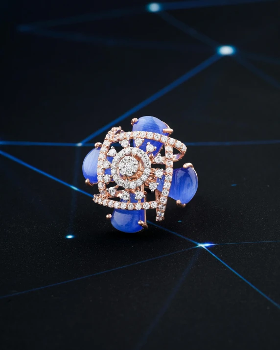 a close up of a ring on a table, blue: 0.5, glowing imperial motifs, crystal nodes, birds eye view