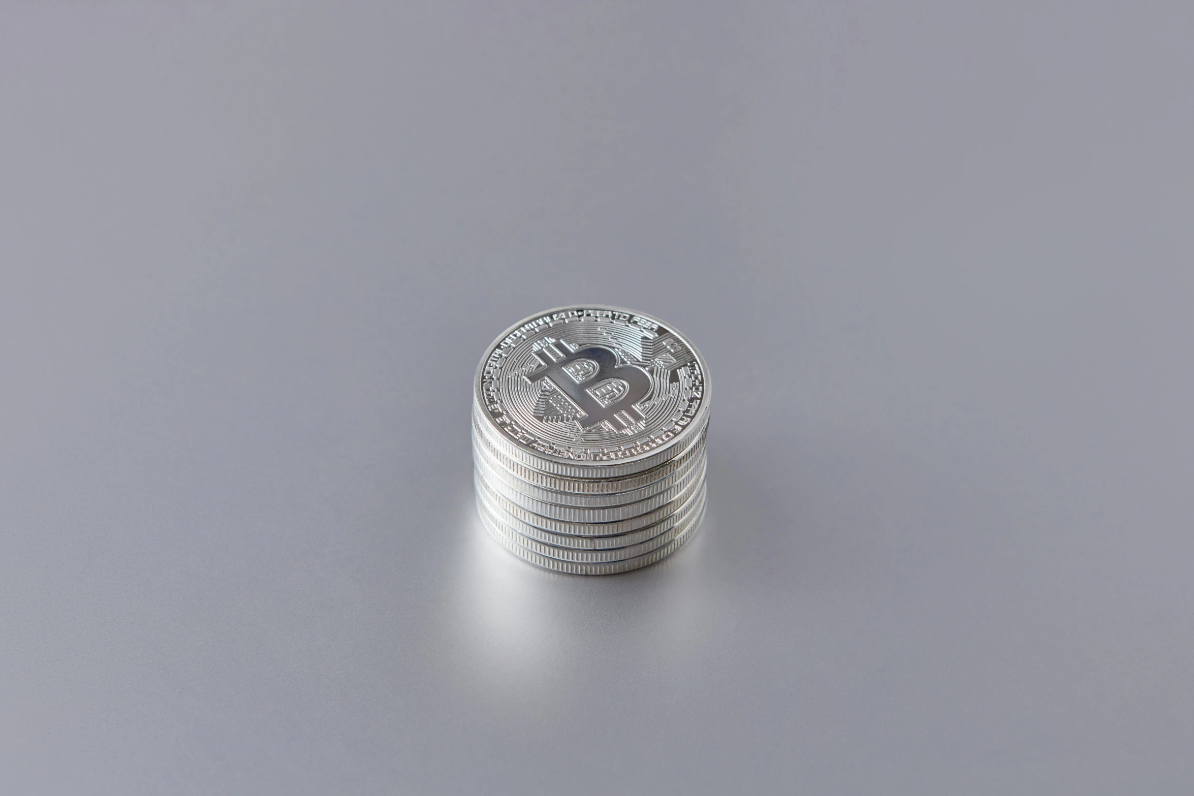 a stack of coins sitting on top of each other, bitcoin, white metal, detailed product image, 1/200s