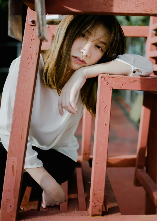 a woman sitting on top of a wooden bench, by Tan Ting-pho, trending on unsplash, realism, brown hair and bangs, model エリサヘス s from acquamodels, white blouse, ((portrait))