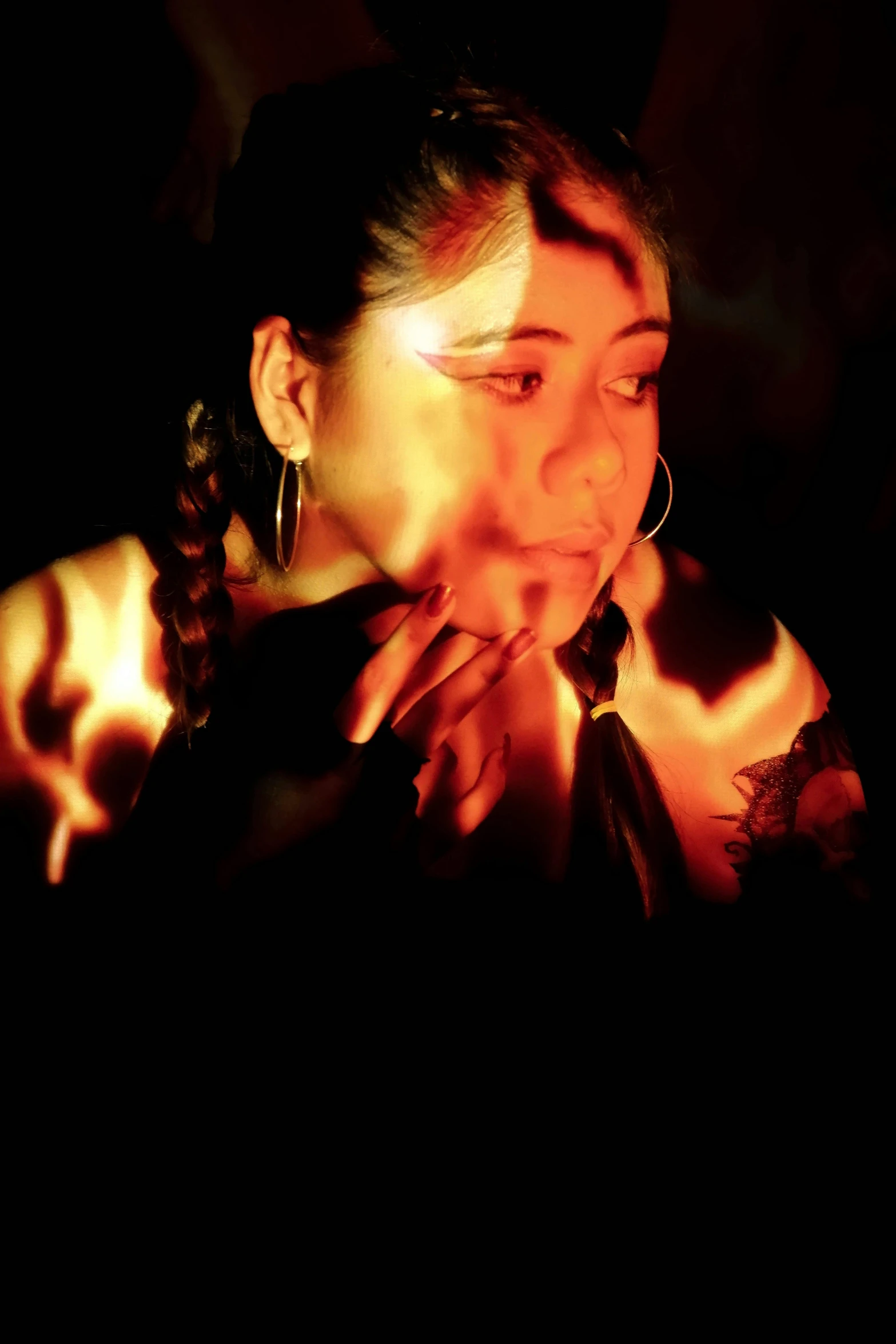 a woman blowing out a candle in the dark, an album cover, inspired by Anna Füssli, hurufiyya, a young female shaman, looking into the flames, slide show, ((portrait))