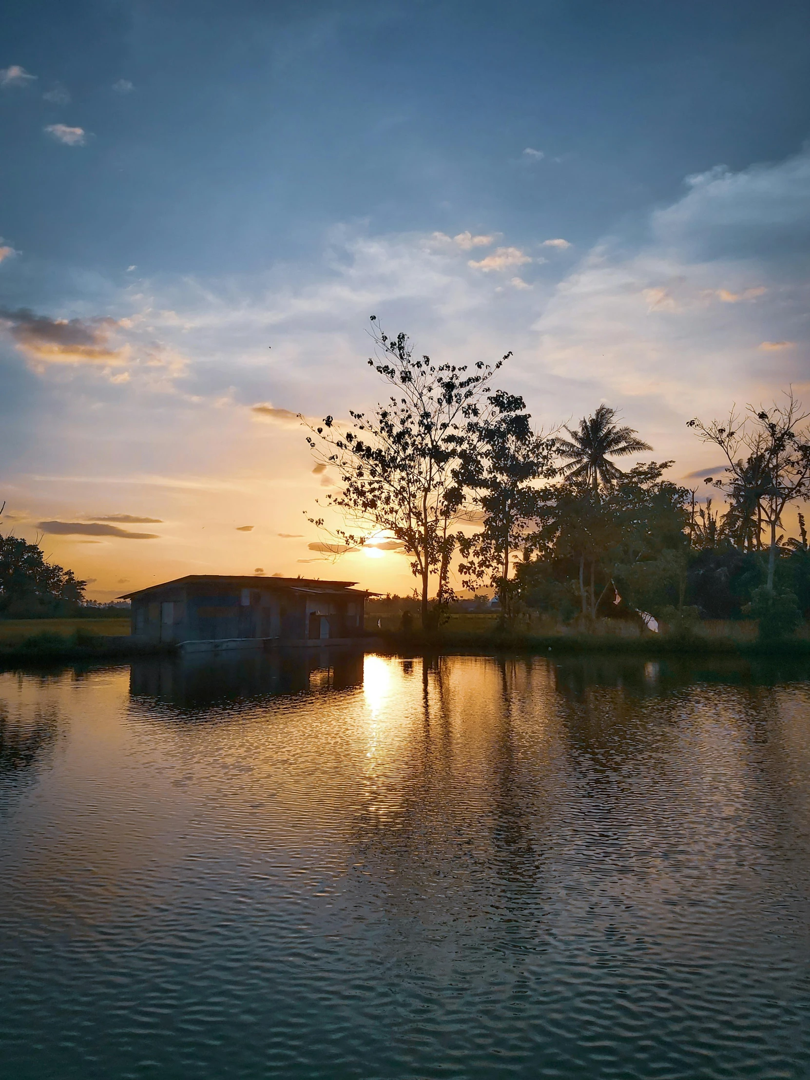 the sun is setting over a body of water, kerala village, golden hour photograph, with cryengine, instagram story