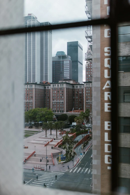 a view of a city from a window, square, los angeles 2 0 1 5, tourist photo, medium closeup