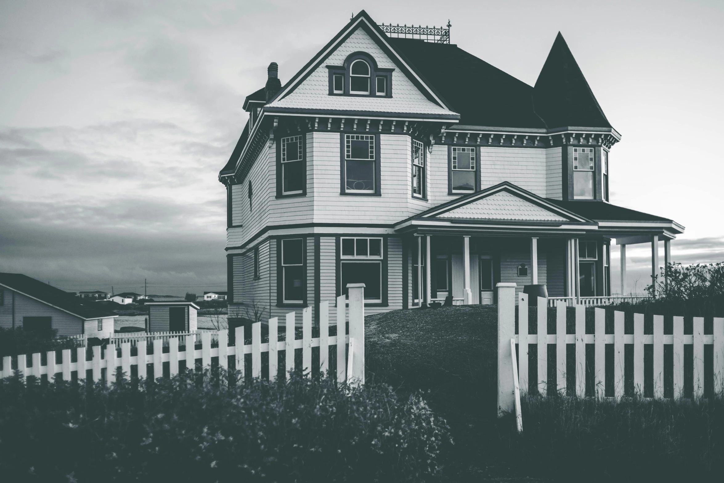 a black and white photo of a large house, by Carey Morris, pexels contest winner, white picket fence, post processed 4k, ominous evening, hd wallpaper