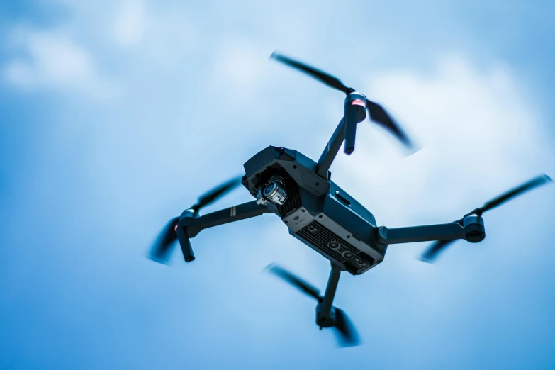 a black drone flying through a blue sky, pexels contest winner, renaissance, electronics, thumbnail, islamic, boston dynamics