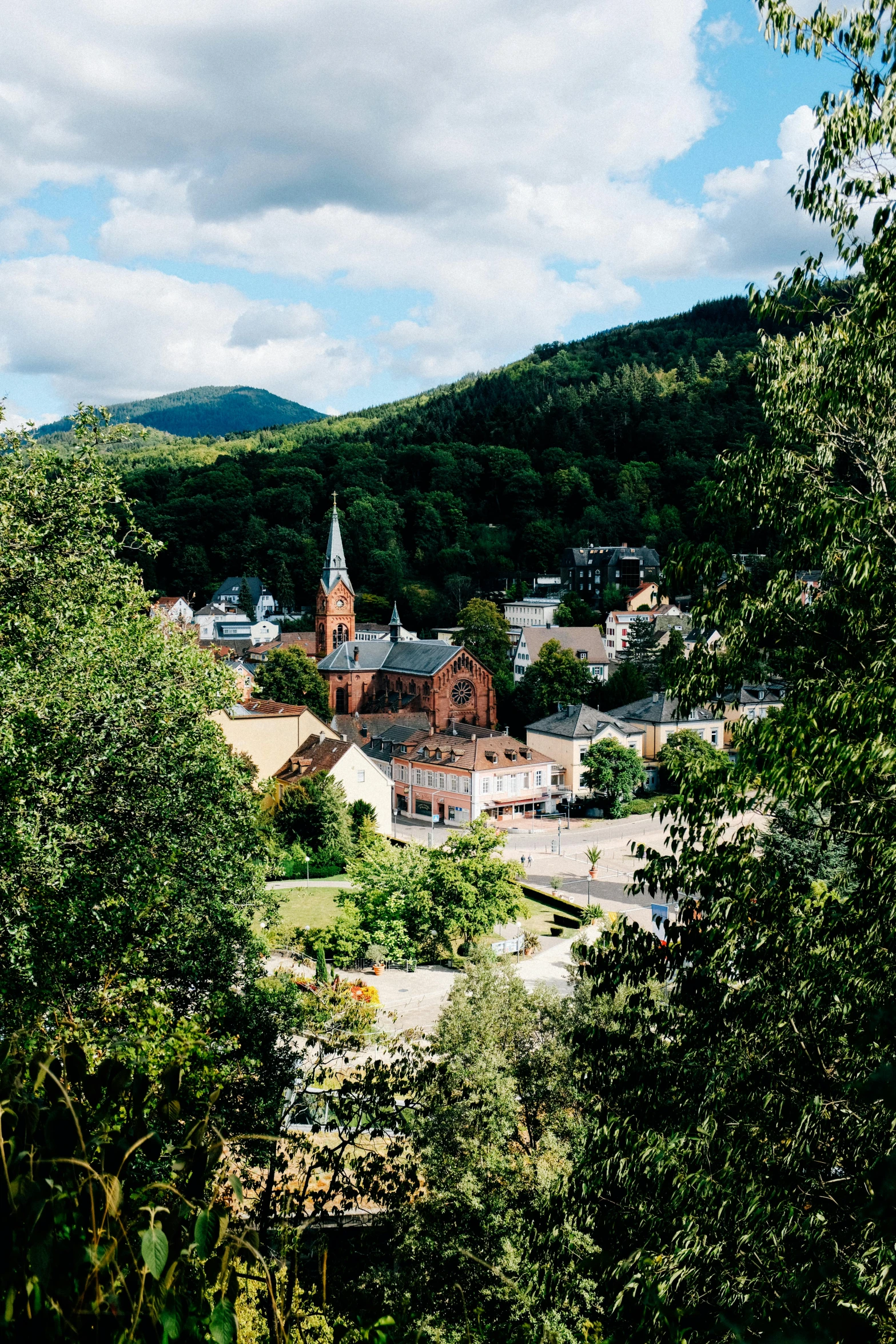 a view of a town from the top of a hill, unsplash, heidelberg school, beautiful swedish forest view, square, new hampshire, july