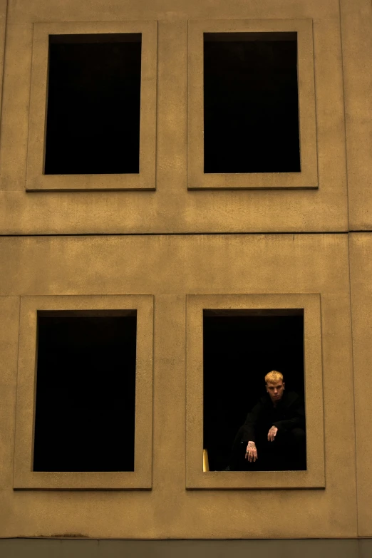 a person looking out of a window in a building, inspired by David Chipperfield, production photo, graham humphreys, julian opie, dramatic”