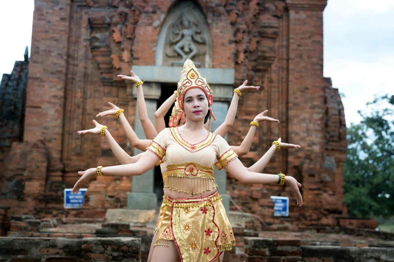 a woman that is standing in front of a building, submerged temple dance scene, in style of lam manh, avatar image