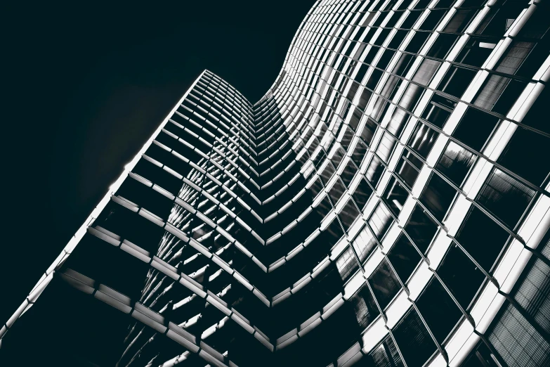 a black and white photo of a tall building, inspired by Zaha Hadid, unsplash contest winner, intricate illuminated lines, canary wharf, curved, perfectly detailed