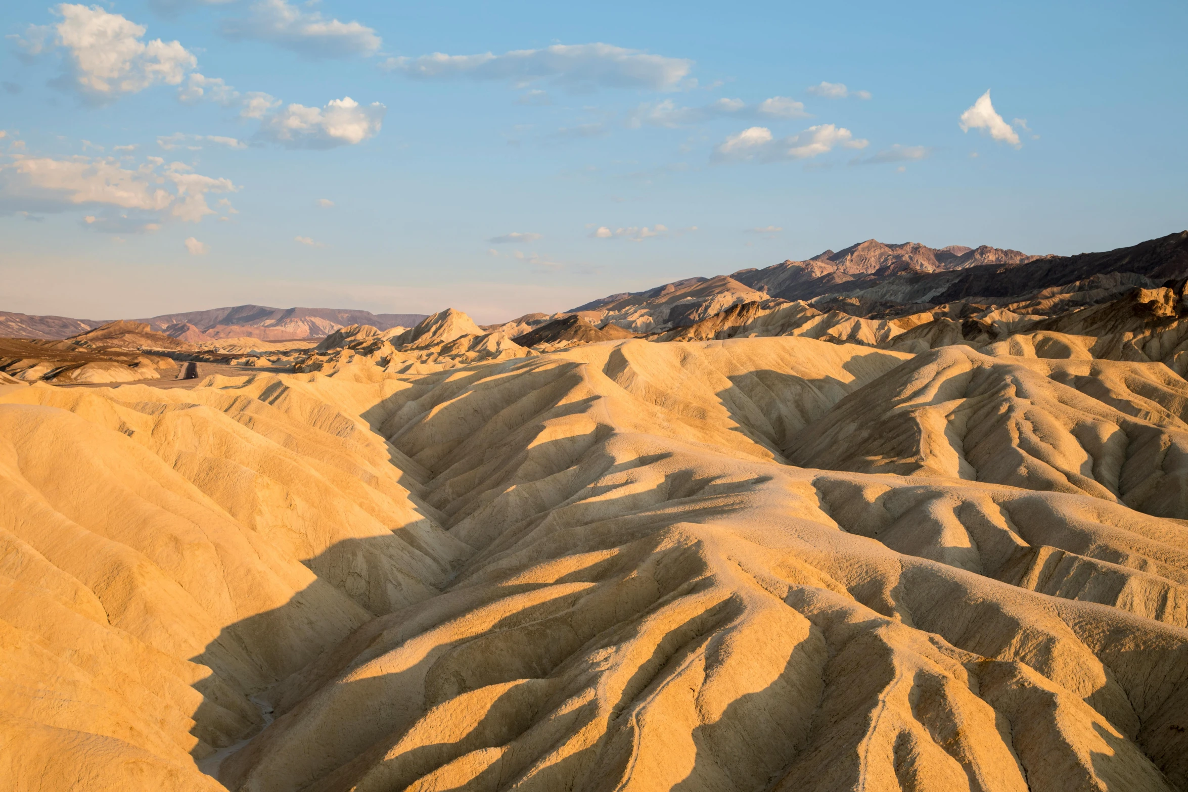 a view from the top of a mountain in death valley national park, death valley national park, death valley national park, death valley national park, by Meredith Dillman, unsplash contest winner, art nouveau, summer morning light, youtube thumbnail, chiseled formations, victorian arcs of sand