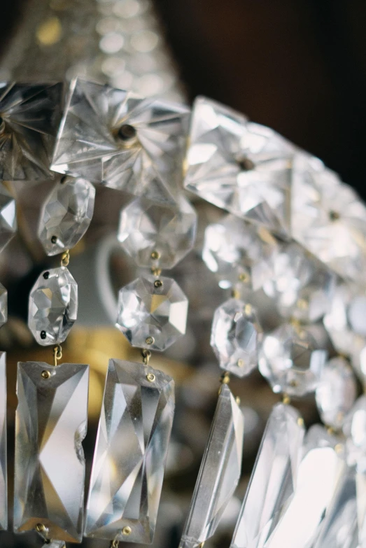 a crystal chandelier hanging from a ceiling, slide show, crystal-embellished, up close, regency-era