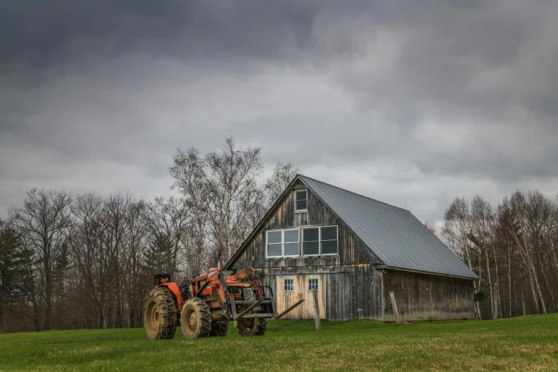 a tractor parked in front of a barn, a portrait, pexels contest winner, hudson river school, big overcast, gambrel roof building, lpoty, a wooden