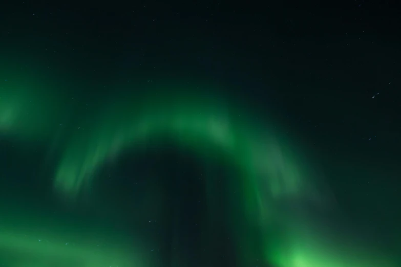 a group of people standing on top of a snow covered slope, by Ejnar Nielsen, pexels contest winner, hurufiyya, glowing green lights, divine ray over her head, panoramic shot, abstract lighting