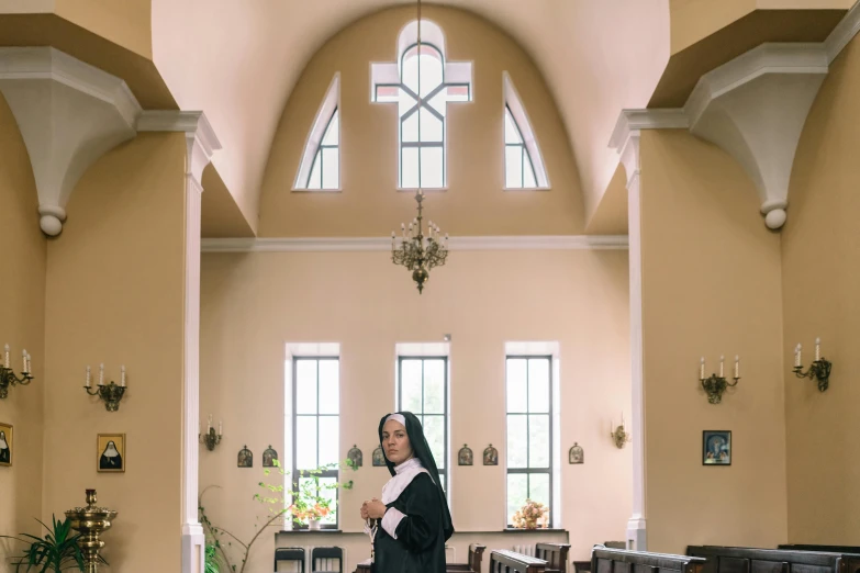 a nun standing in the middle of a church, a portrait, unsplash, portrait image, fullbody photo, delightful surroundings, server