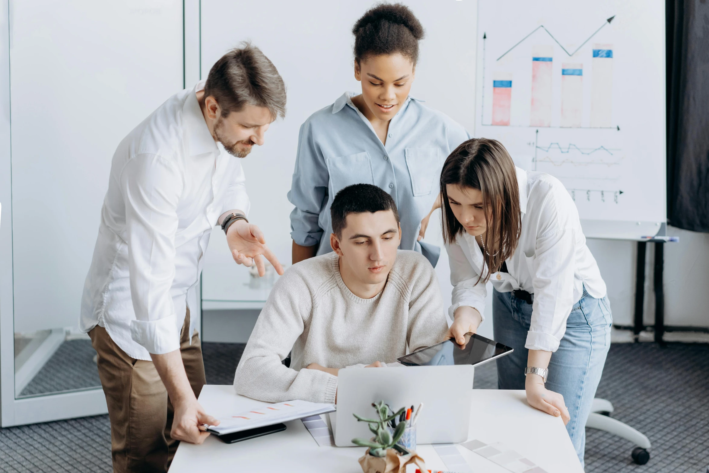 a group of people standing around a table with a laptop, trending on pexels, te pae, thumbnail, workers, dylan kowalsk