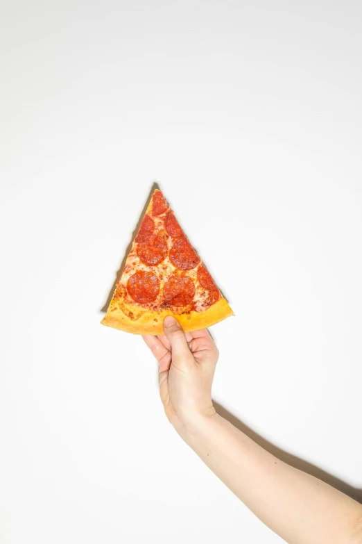 a person holding a slice of pizza in their hand, by Matthias Stom, trending on unsplash, photorealism, flat triangles, wall corner, with a white background, folded