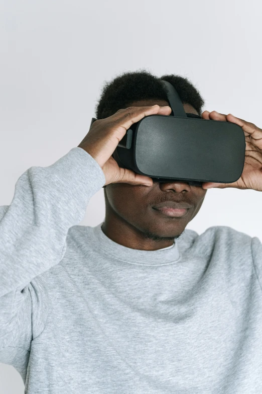 a man using a virtual reality headset against a white background, by Carey Morris, trending on unsplash, afrofuturism, black teenage boy, detailed photo of virtual world, 2020 video game screenshot, siggraph