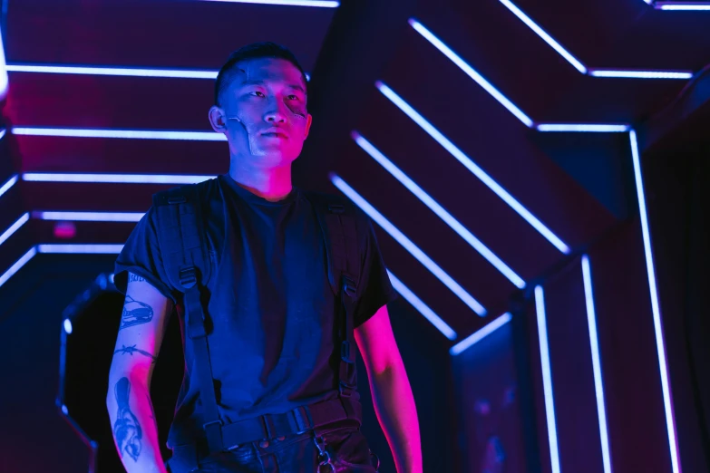 a man standing in front of a neon tunnel, an album cover, by Byron Galvez, pexels contest winner, wearing techwear and armor, cai xukun, reflecting light in a nightclub, avatar image