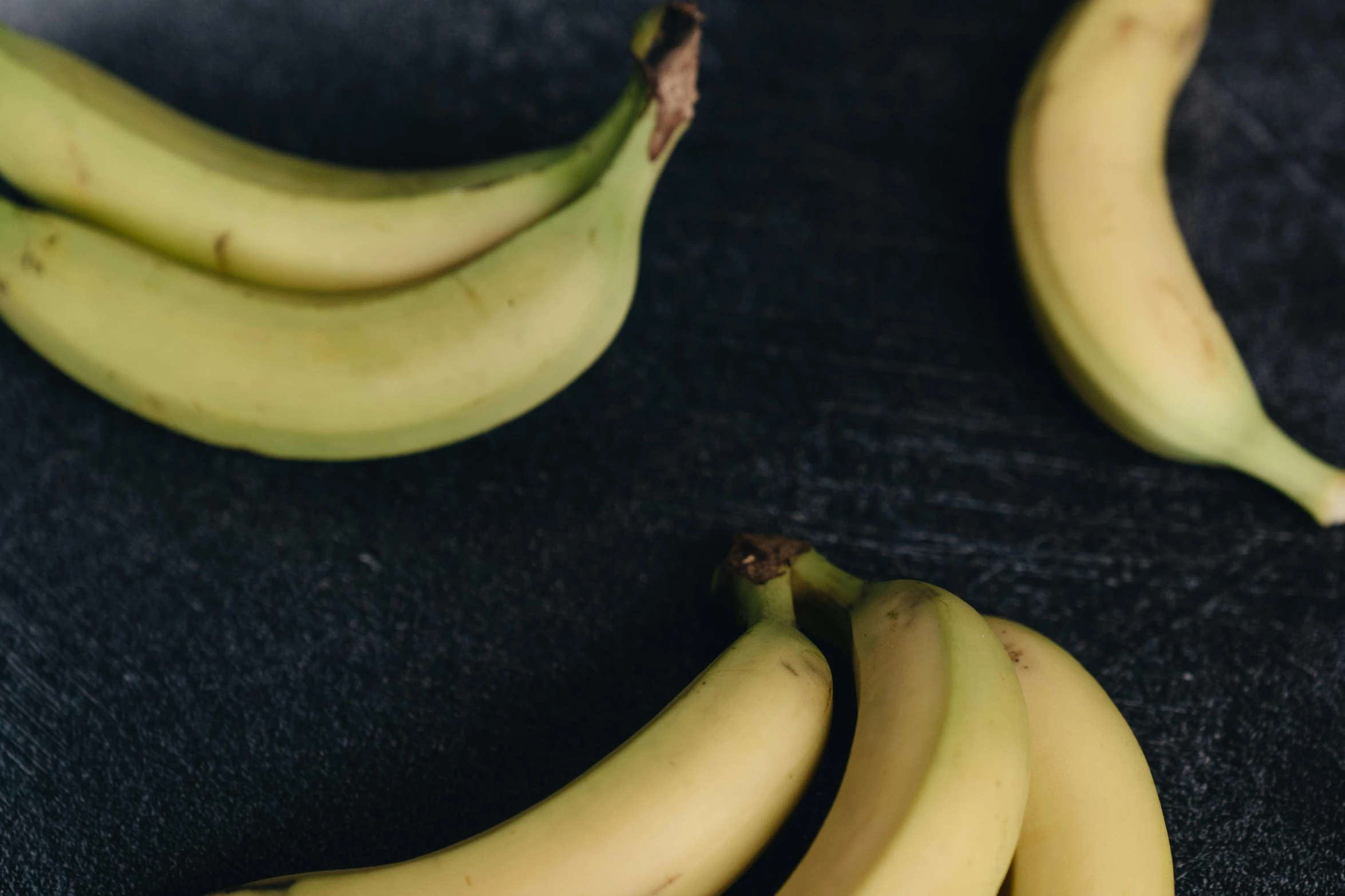 a bunch of bananas sitting on top of a table, grey, background image, digital image, thumbnail