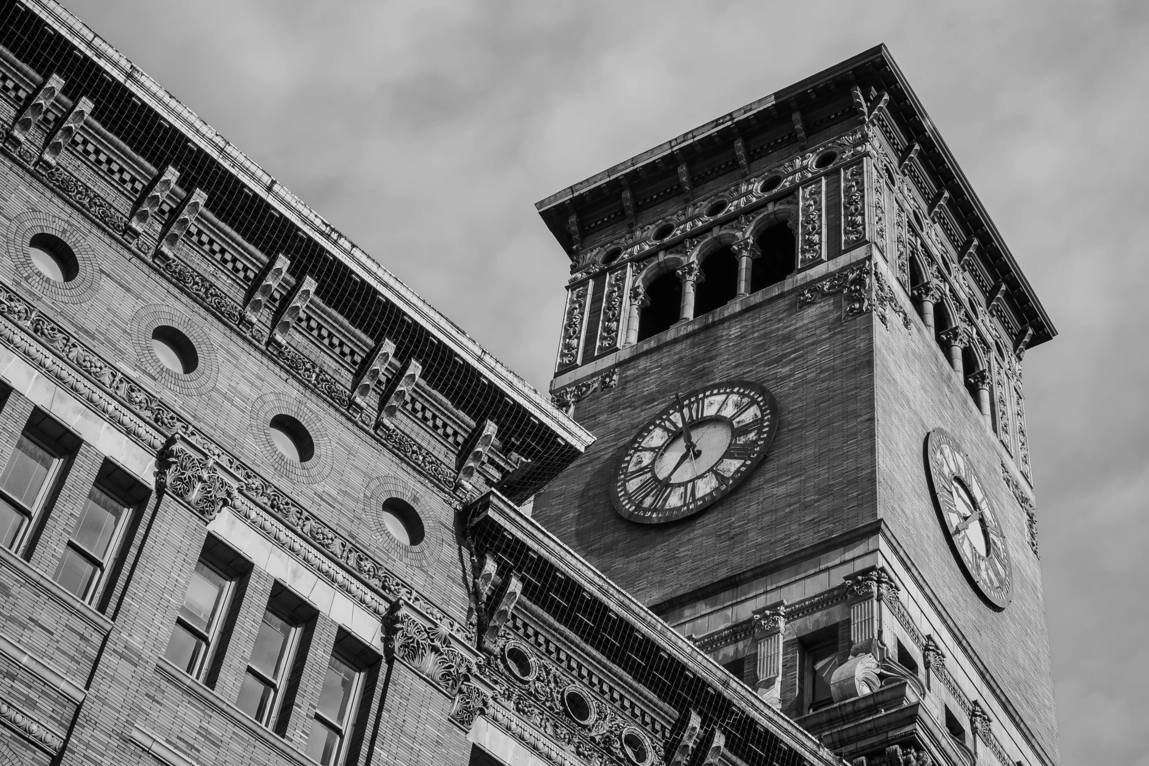 a black and white photo of a clock tower, by Sven Erixson, pexels contest winner, vancouver school, brick building, ornately dressed, featured art, montreal