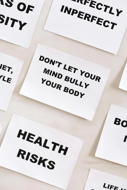 a bunch of sticky notes sitting on top of a table, poster art, by Nicolette Macnamara, trending on pexels, body is strong and upright, black on white background, medical labels, bullying