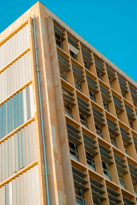 a tall building with a blue sky in the background, brown, solarised, parallax »