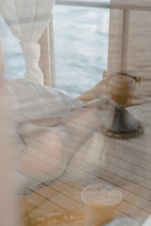 a bed sitting on top of a wooden floor next to a window, a picture, unsplash, figuration libre, translucent skin, floating on the ocean, close - up photograph, jovana rikalo