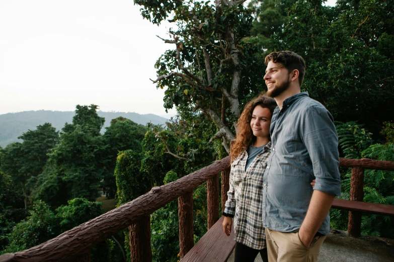 a man and a woman standing next to each other, pexels contest winner, jungle in background, balcony scene, profile image, thumbnail