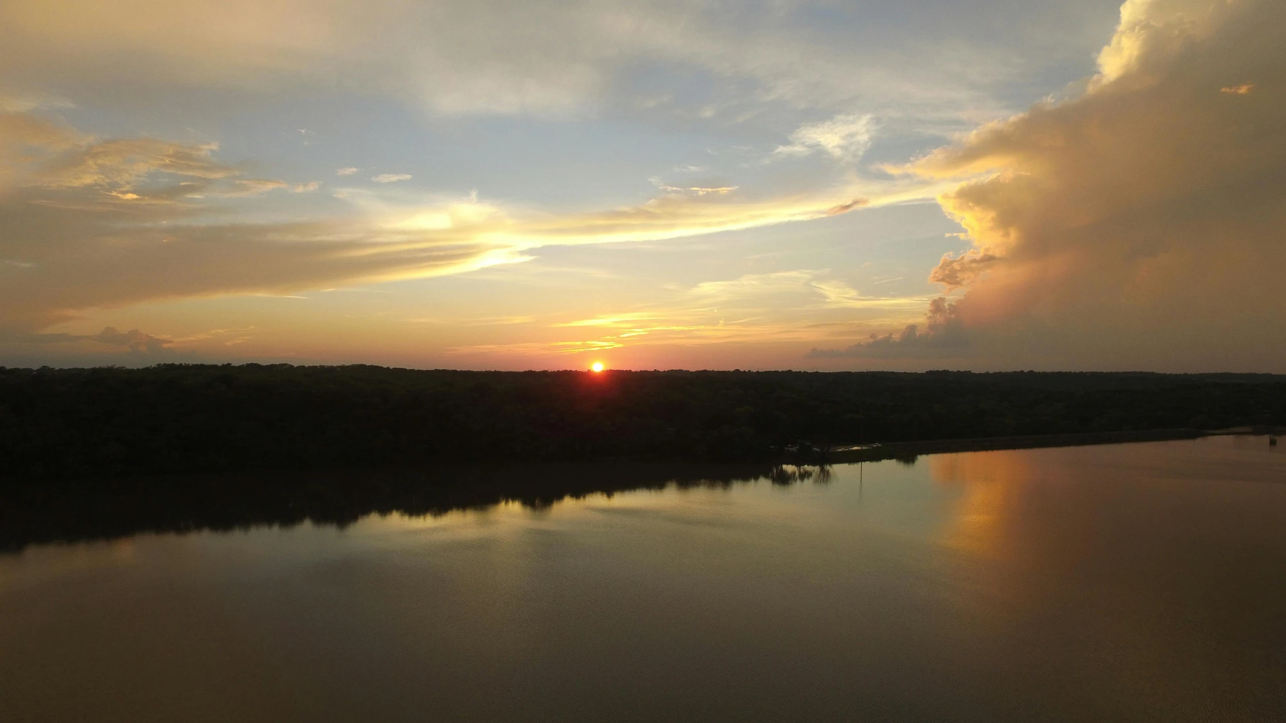 the sun is setting over a body of water, a picture, pexels contest winner, red river, slide show, view from high, reflection