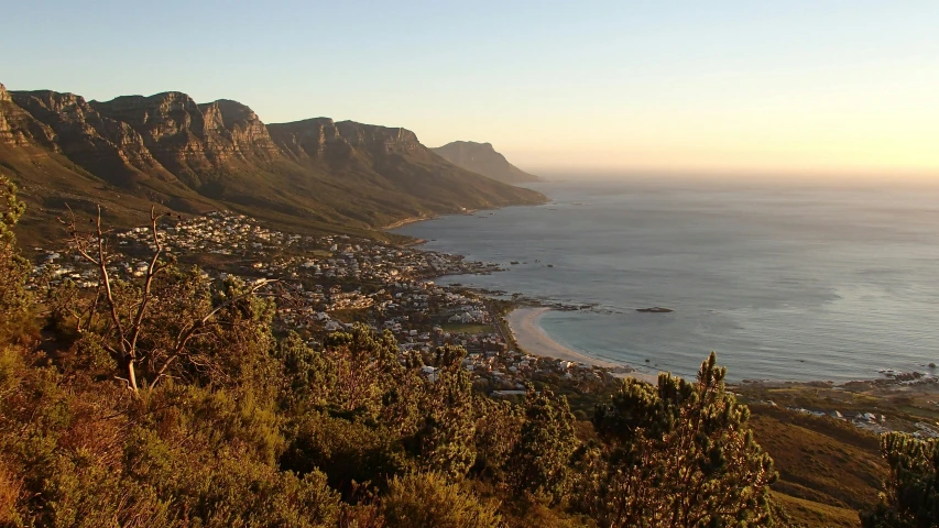 a view of the ocean from the top of a mountain, by Daniel Lieske, pexels contest winner, renaissance, cape, evening sun, a quaint, panoramic