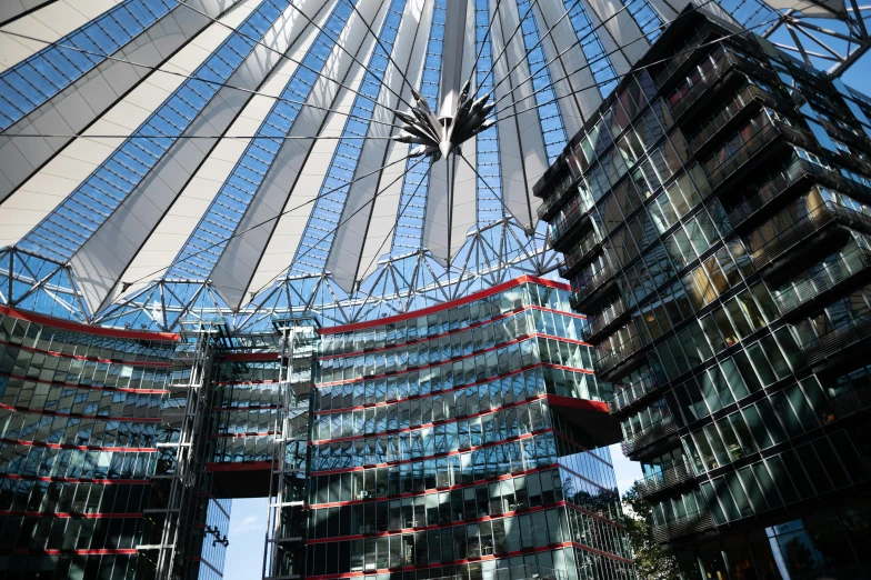 a view of the inside of a modern building, a photo, inspired by Zaha Hadid, lead - covered spire, holding an epée, in the center of the image, german