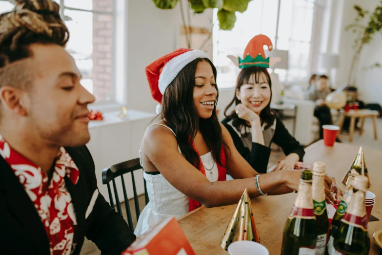 a group of people sitting around a wooden table, wearing a santa hat, profile image, professional image, high quality image