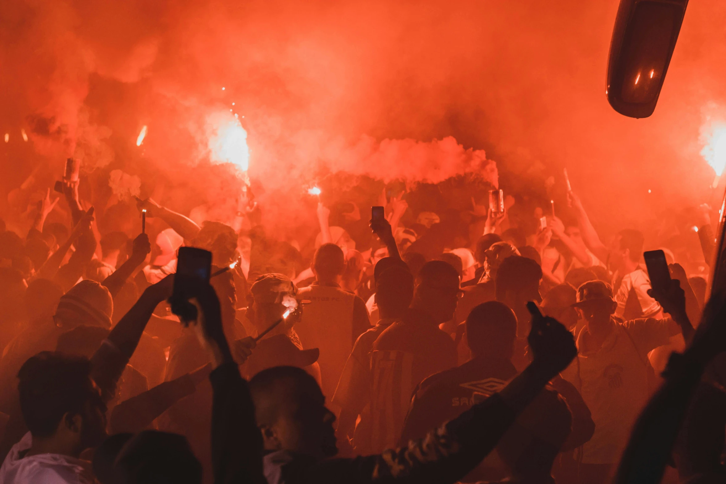 a crowd of people holding up their cell phones, pexels, happening, mangeta smoke red light, liverpool football club, 🚿🗝📝, thunderstorm in marrakech